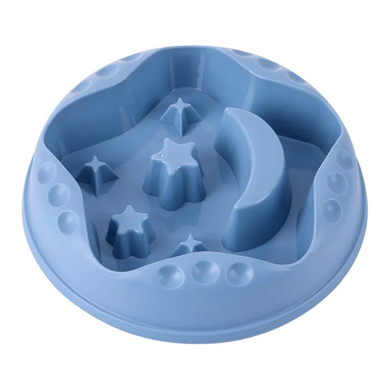 Blue slow feeder dog bowl with raised moon and star patterns inside, non-slip base