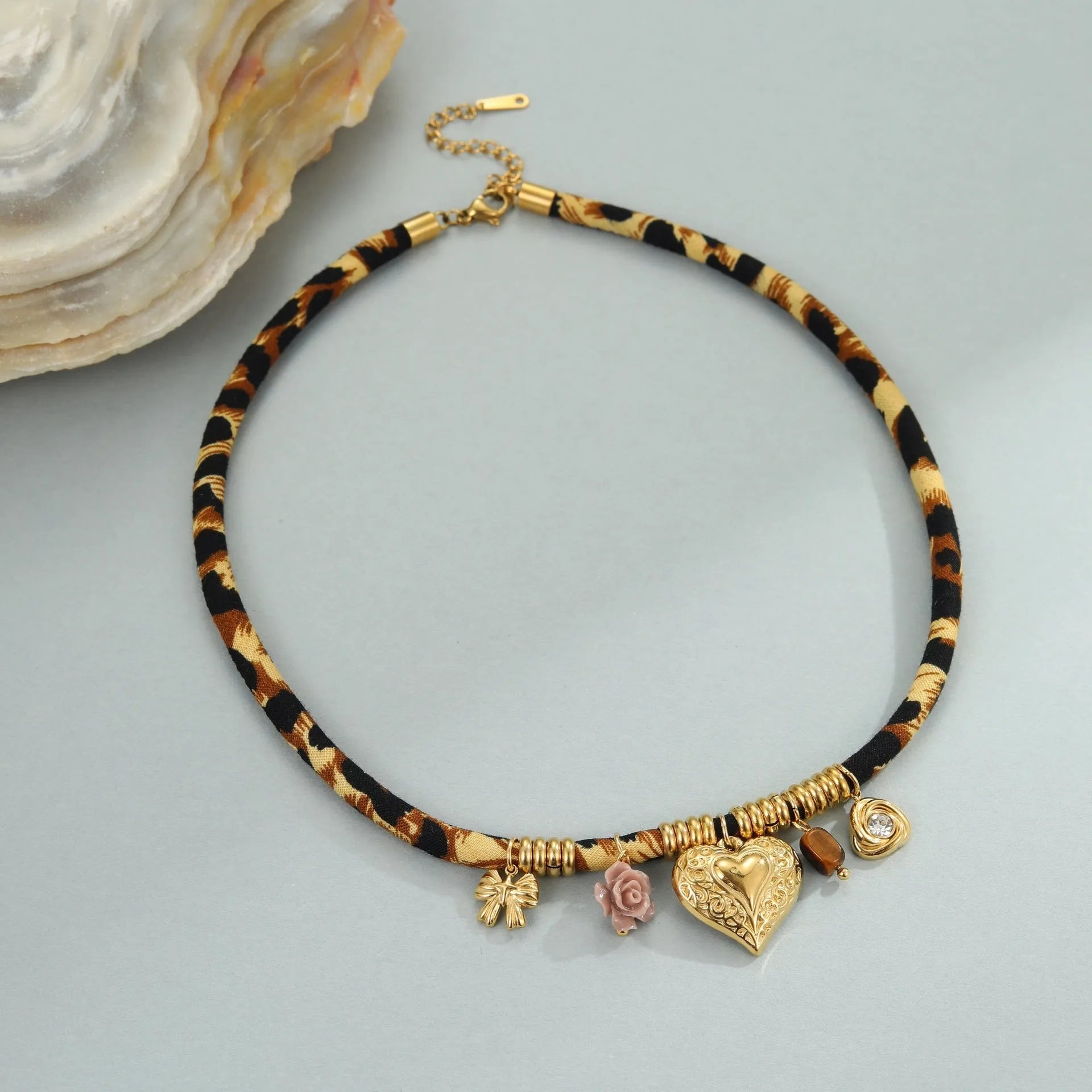 Stainless steel necklace with geometric leopard pendant on adjustable chain, 18K electroplated finish