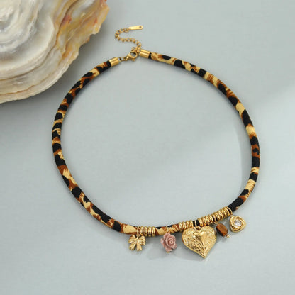 Stainless steel necklace with geometric leopard pendant on adjustable chain, 18K electroplated finish