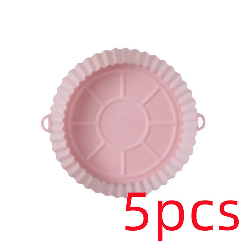 Round blue silicone baking tray mat with 4.5cm sides on a kitchen counter.
