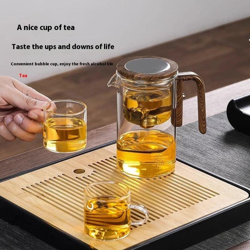 Elegant glass teapot with magnetic water separation filter and wooden handle for brewing and pouring loose leaf tea