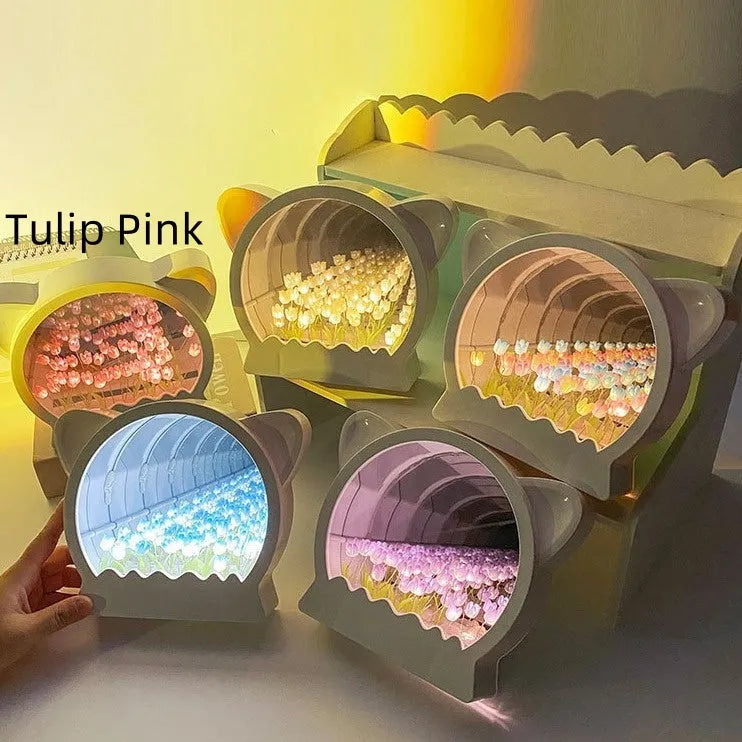 Handmade DIY cat head shaped night lamp with colourful tulip flower sea decoration on a table.