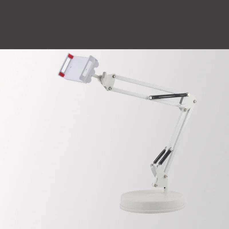 Black metal adjustable phone and tablet stand with a heavy round base on a wooden desk