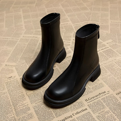 Women's black flat heel ankle boots with back zipper and round toe