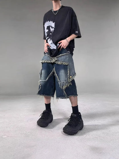 Blue men's denim shorts with frayed hem, loose fit, and a white five-pointed star patch on the leg.