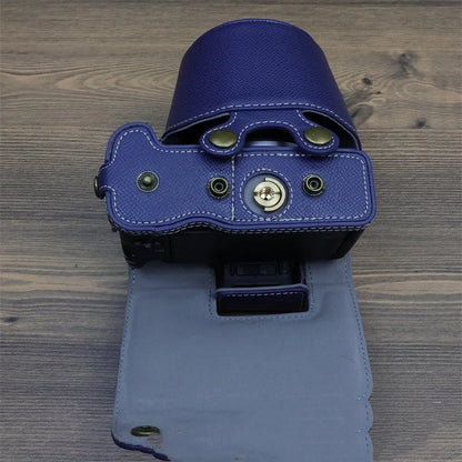 PU shoulder bag for a single mirrorless camera, shown in oil skin or palm print finish
