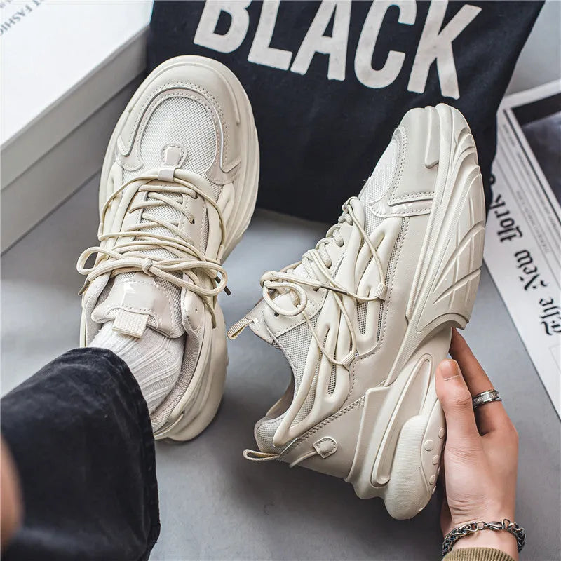 Men's low-top lace-up sneakers in mesh and PU leather with rubber sole, shown in beige and black colours.