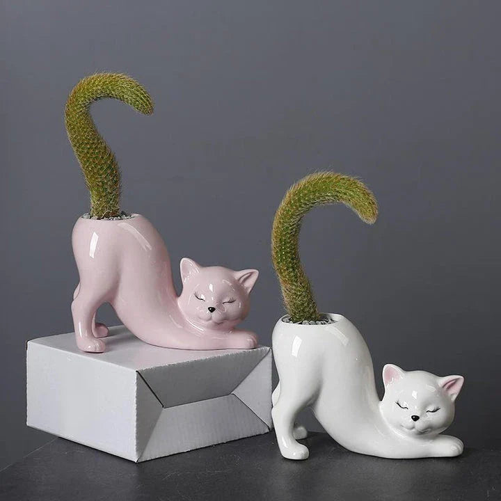 A charming cartoon cat-shaped flower pot made of high-quality glazed porcelain, perfect for adding a playful touch to your home or office decor.