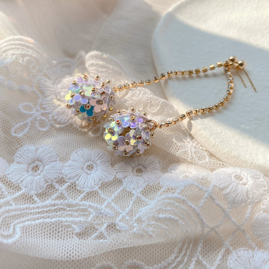 Elegant sterling silver floral drop earrings with delicate petal details, a timeless accessory for the modern British woman.