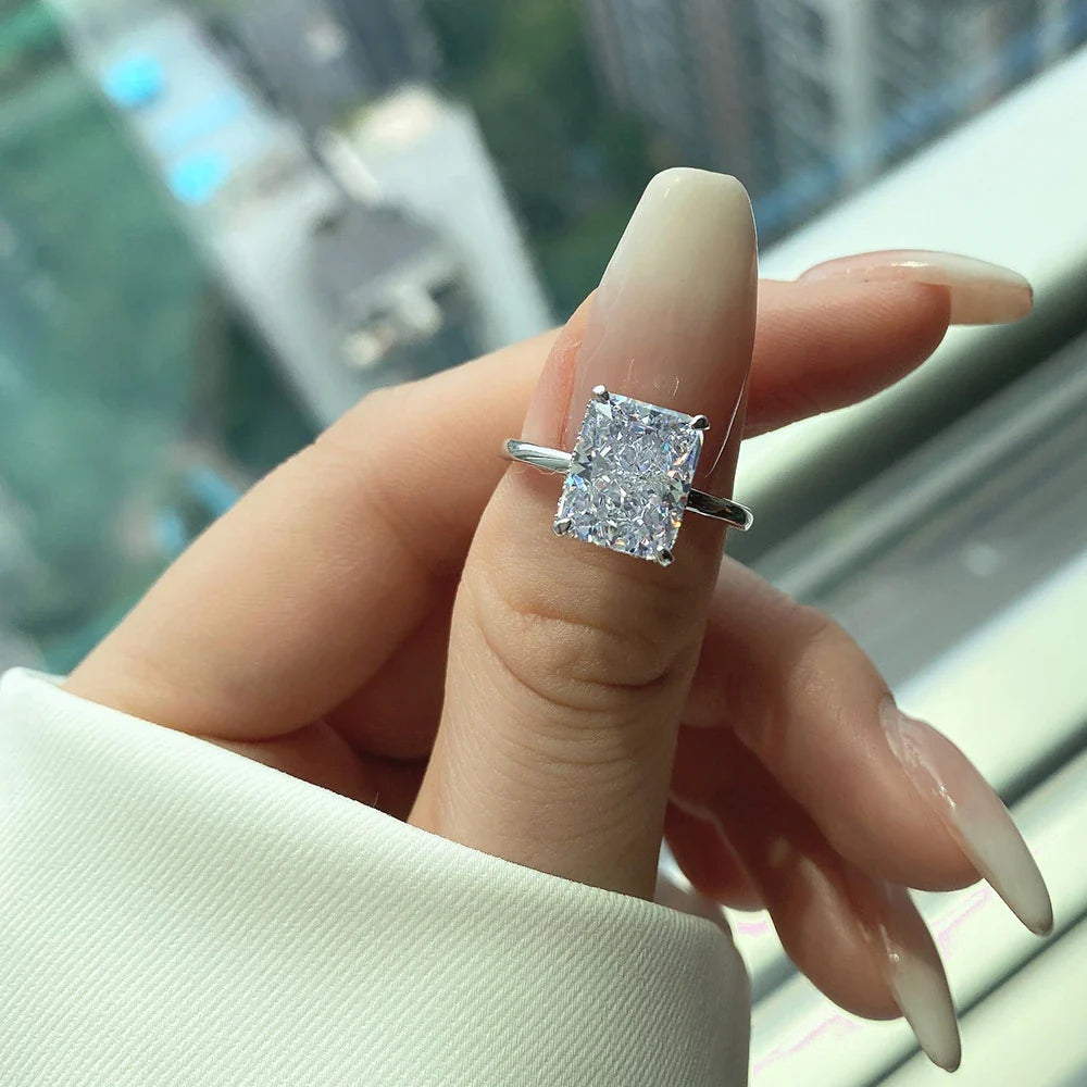 Elegant 4-Claw S925 Sterling Silver Zircon Ring with a quadrilateral setting and radiant zircon centre stone