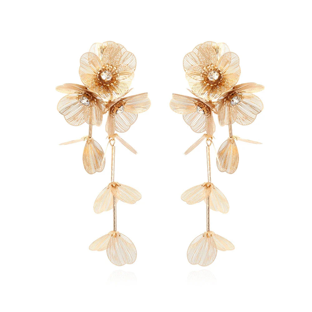 Elegant metal flower charm earrings and necklace set with delicate floral designs and metallic accents