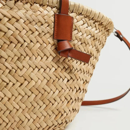 Elegant woven wicker basket bag in brown, perfect for summer adventures and carrying essentials