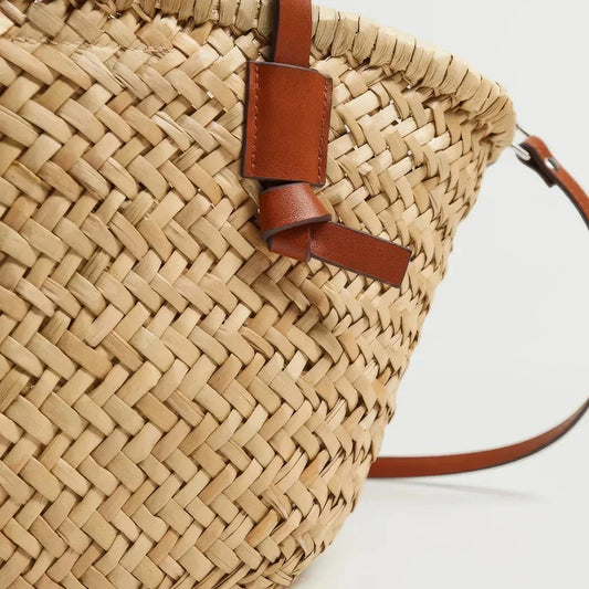Elegant woven wicker basket bag in brown, perfect for summer adventures and carrying essentials