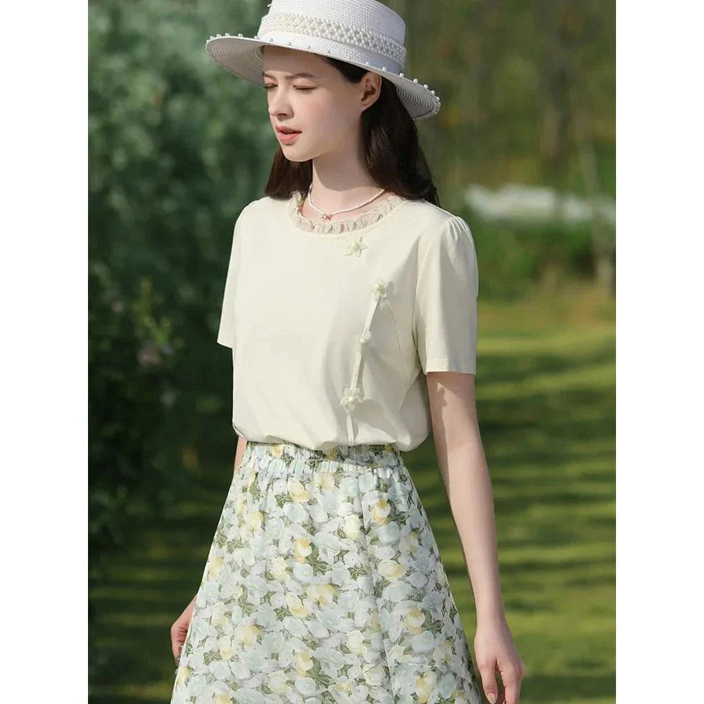 Elegant floral short sleeve t-shirt with wooden ear side detail, perfect for chic British summer style