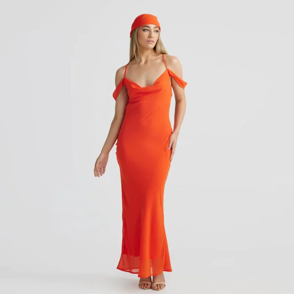 Elegant off-shoulder maxi dress in orange colour, featuring a halter backless design and pile collar neckline for a sophisticated look.