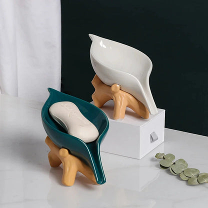 Elegant ceramic leaf-shaped soap holder with a sturdy base, adding a touch of nature-inspired sophistication to any bathroom