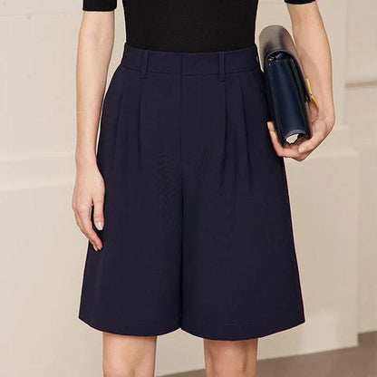 Elegant wide-leg shirred shorts in deep blue, designed for the modern British woman
