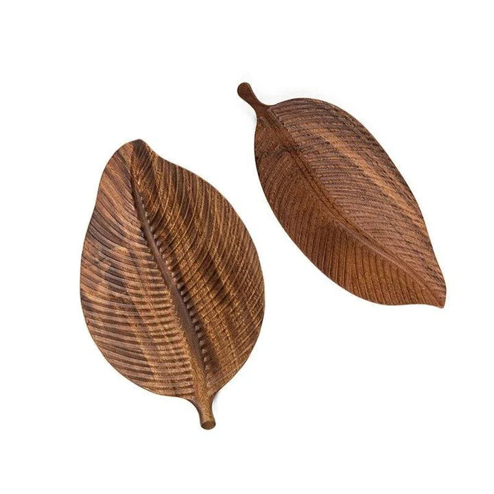 Elegant leaf-shaped serving platter made of solid oak wood, featuring a natural and stylish design for hosting and entertaining