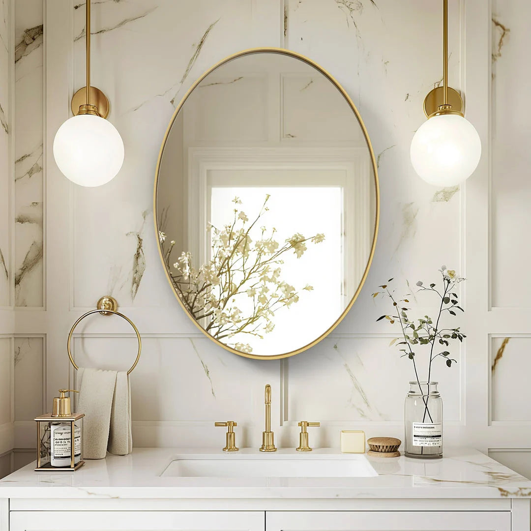 Elegant oval gold wall mirror with a contemporary decorative brushed gold frame