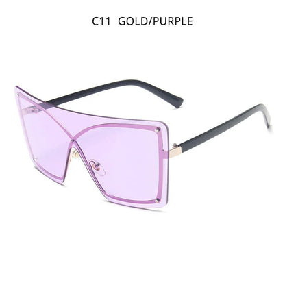 Stylish oversized flat top sunglasses with a rimless design, providing UV protection and a comfortable fit for the modern British woman