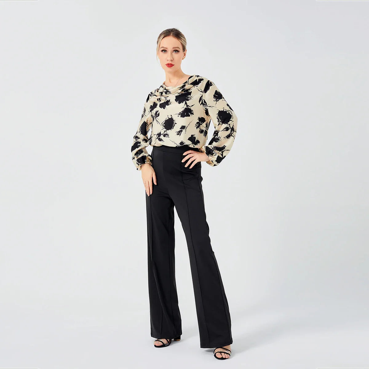 Elegant ladies' blouse with a printed pattern, dropped collar, and long sleeves in a classic white colour