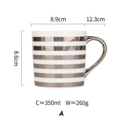 Elegant porcelain coffee mug with a lustrous gold heart design, perfect for enjoying hot beverages in style.