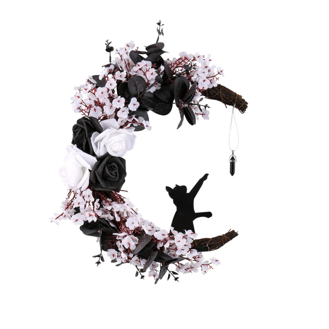 Spooktacular Halloween garland featuring a blend of dried white flowers, black roses, and mystical moon cat ornaments