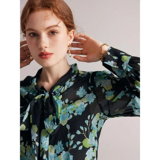 Elegant floral silk blend blouse for women featuring a bow collar, puff sleeves, and a flattering straight-cut silhouette