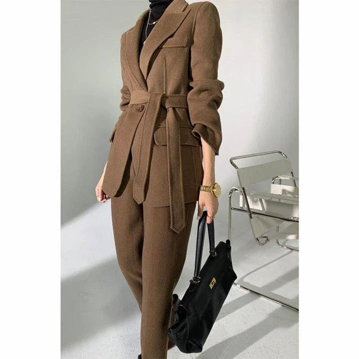 Elegant wool pant suits for women featuring a high-waist design, raglan sleeves, and modern 'hip hop' style trousers in a solid black colour