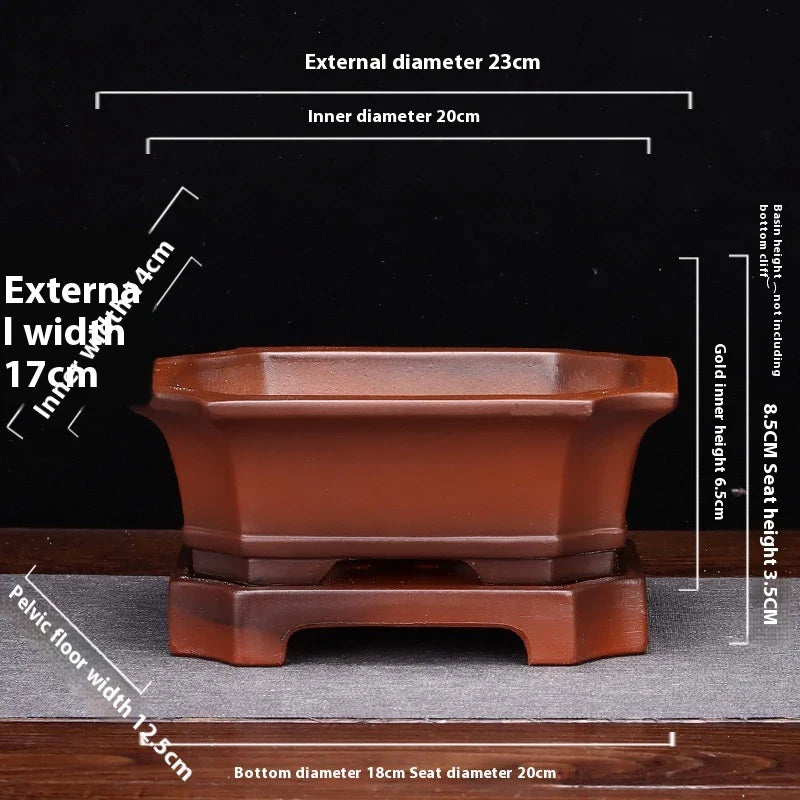 Elegant ceramic bonsai planter in red and dark green colours, with a refined antique-inspired design suitable for desktop or indoor use