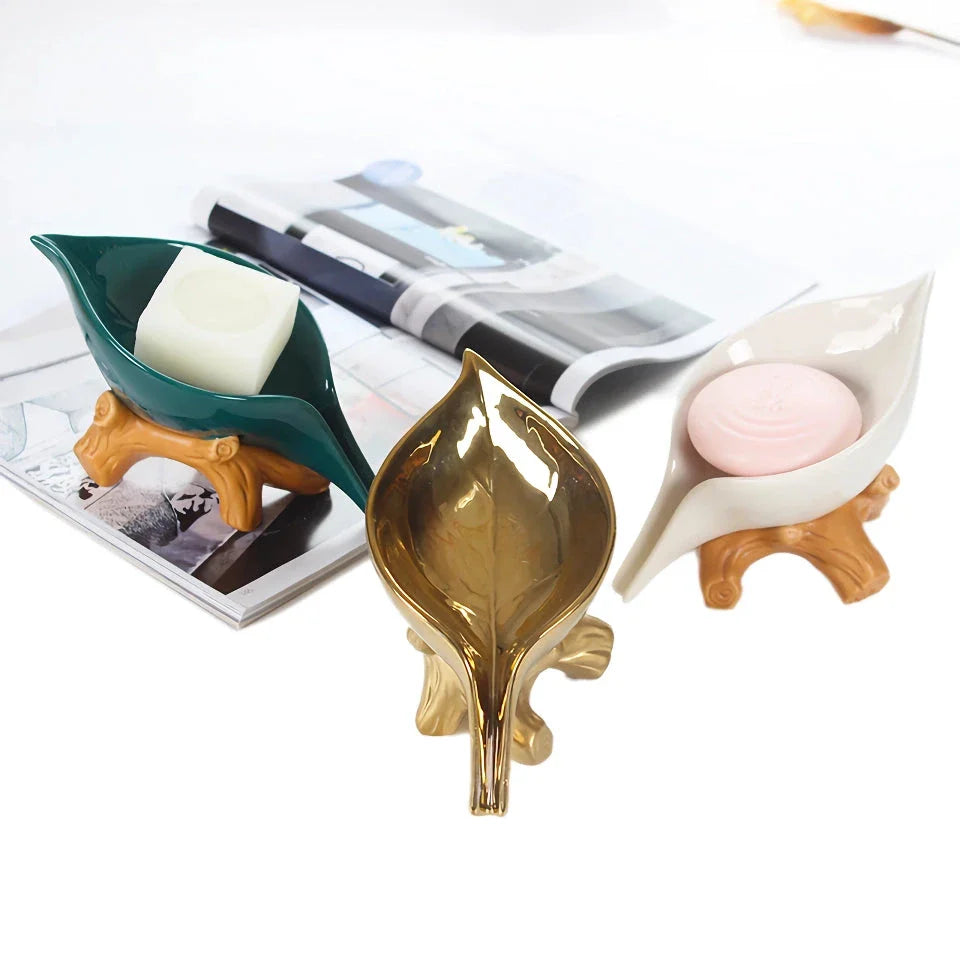 Elegant ceramic leaf-shaped soap holder with a sturdy base, adding a touch of nature-inspired sophistication to any bathroom