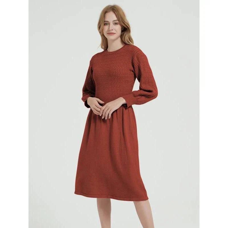 Elegant long sleeve knitted sweater dress in red with a classic A-line silhouette and mid-calf length