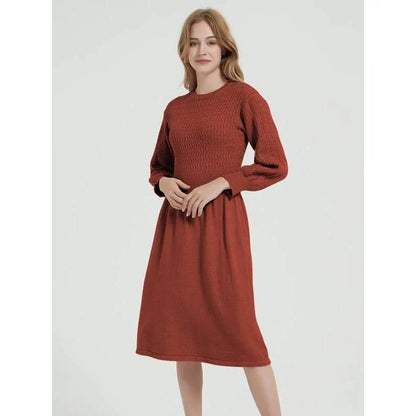 Elegant long sleeve knitted sweater dress in red with a classic A-line silhouette and mid-calf length