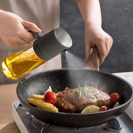 Elegant borosilicate glass oil spray bottle with ergonomic design for hassle-free, healthy cooking