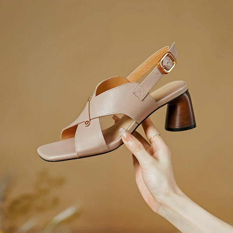 Elegant leather high heel sandals in khaki colour for women, featuring a 5.5 cm square heel, secure buckle strap, and sleek design.