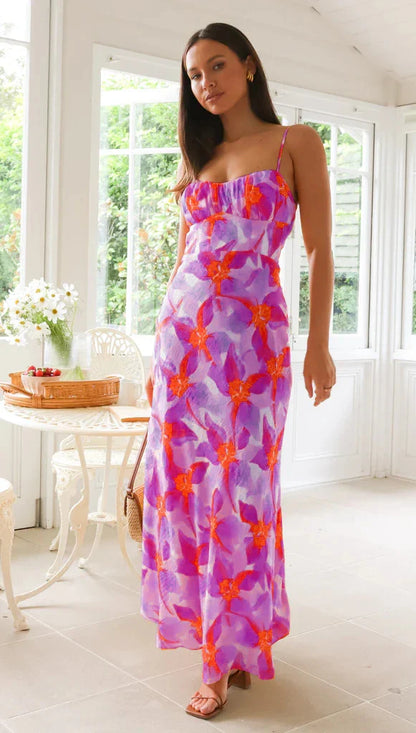 Elegant floral midi dress with backless design, available in yellow, purple, and green colours