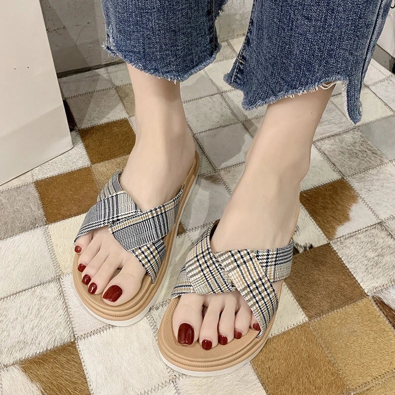 Comfortable and stylish herringbone slippers with a charming bow detail, perfect for indoor and light outdoor use.