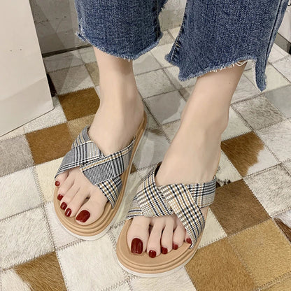 Comfortable and stylish herringbone slippers with a charming bow detail, perfect for indoor and light outdoor use.