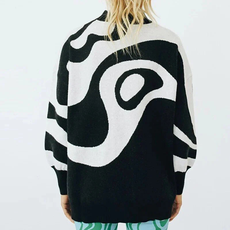 Chic striped turtleneck oversized jumper for women in black colour, featuring a relaxed fit and stylish pattern