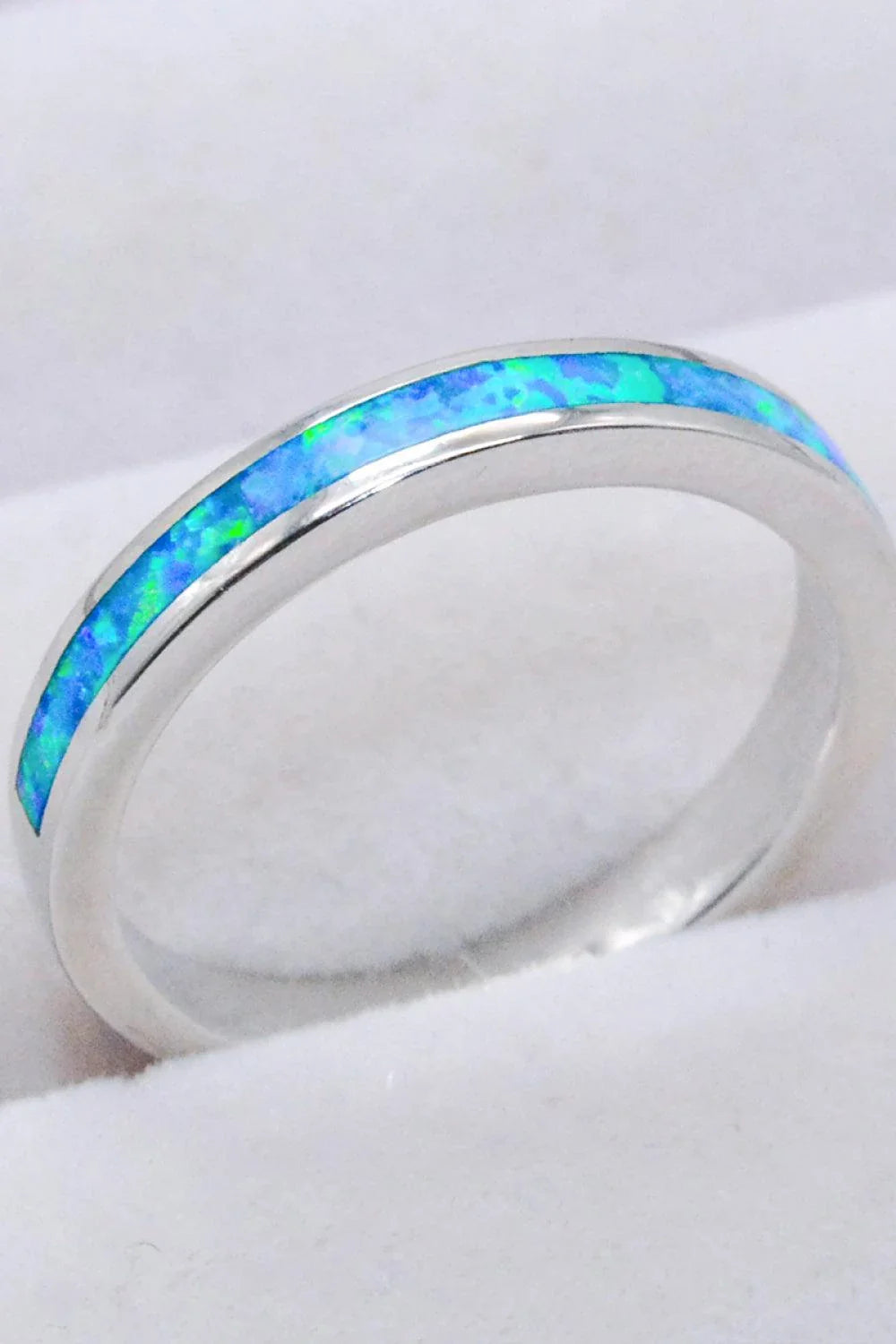 Elegant sterling silver ring with a mesmerizing sky blue opal gemstone, a modern and sophisticated accessory.