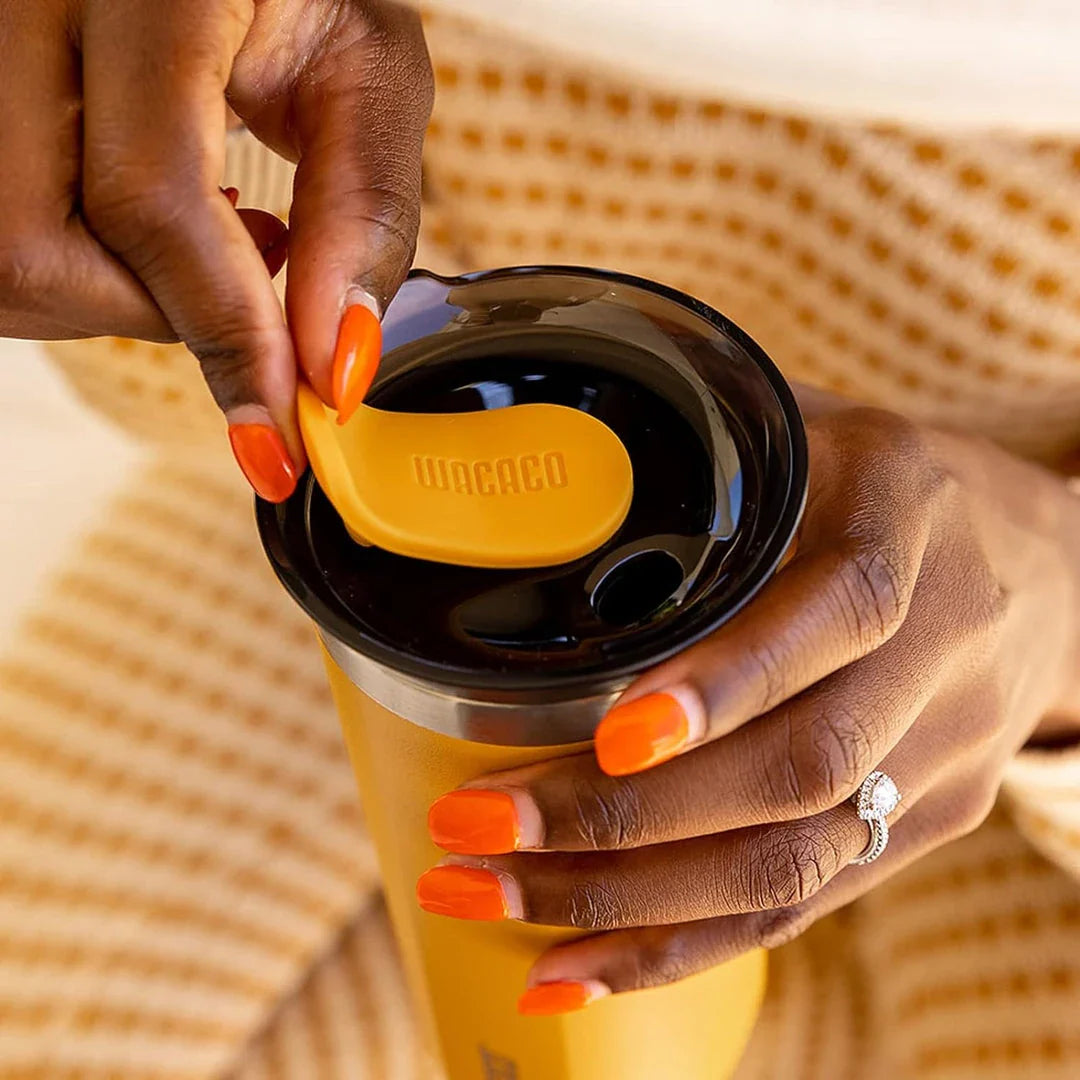 Premium insulated stainless steel travel mug in various vibrant colours, designed for keeping hot and cold drinks at the perfect temperature for on-the-go British lifestyles.