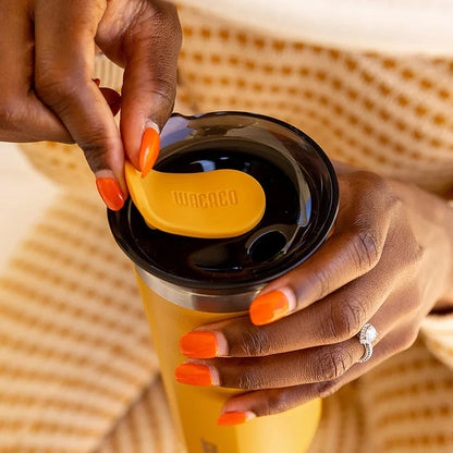 Premium insulated stainless steel travel mug in various vibrant colours, designed for keeping hot and cold drinks at the perfect temperature for on-the-go British lifestyles.