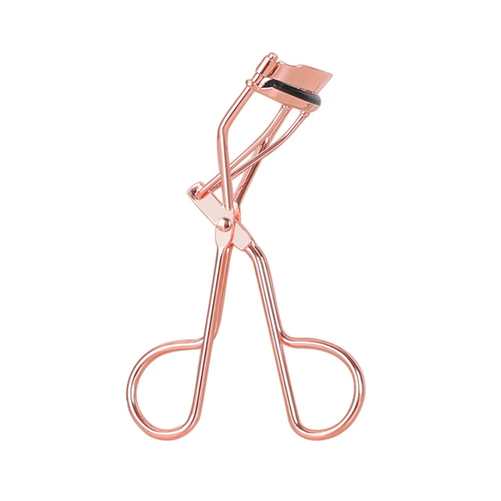 Rose gold eyelash curler with a silicone pad for gentle, long-lasting lash curling