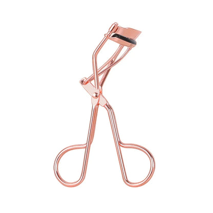 Rose gold eyelash curler with a silicone pad for gentle, long-lasting lash curling