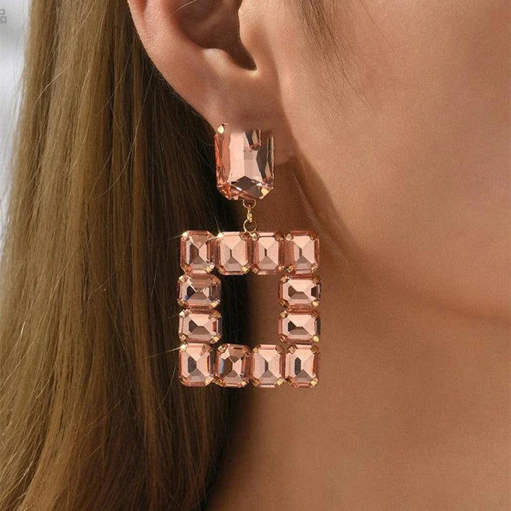 Pair of enchanting crystal earrings made with premium artificial crystals in various colours including rose red, green, pink, champagne, and black