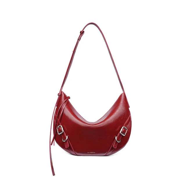 Elegant leather shoulder and crossbody bag for women, featuring a spacious main compartment, interior zip pocket, and contemporary design