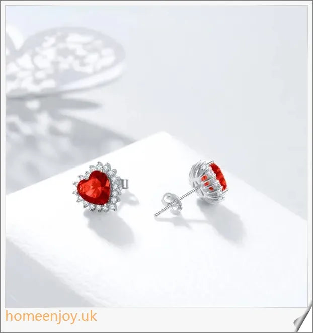 Elegant sterling silver earrings featuring a heart-shaped design and sparkling cubic zirconia stones