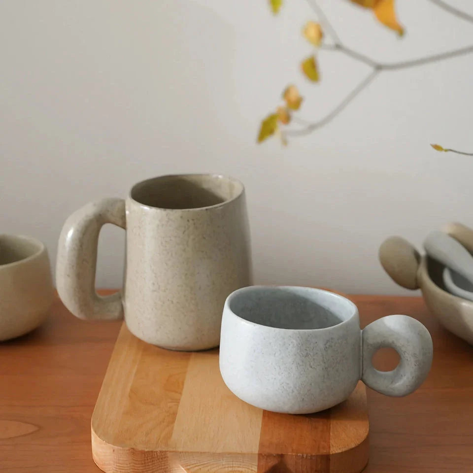 Elegant Japanese stoneware retro coffee mug in solid apricot and grey colours with comfortable handgrip shape