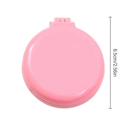 Portable folding hair comb with mirror, featuring a dual-sided design with a round mirror and eco-friendly hairbrush for on-the-go styling and grooming