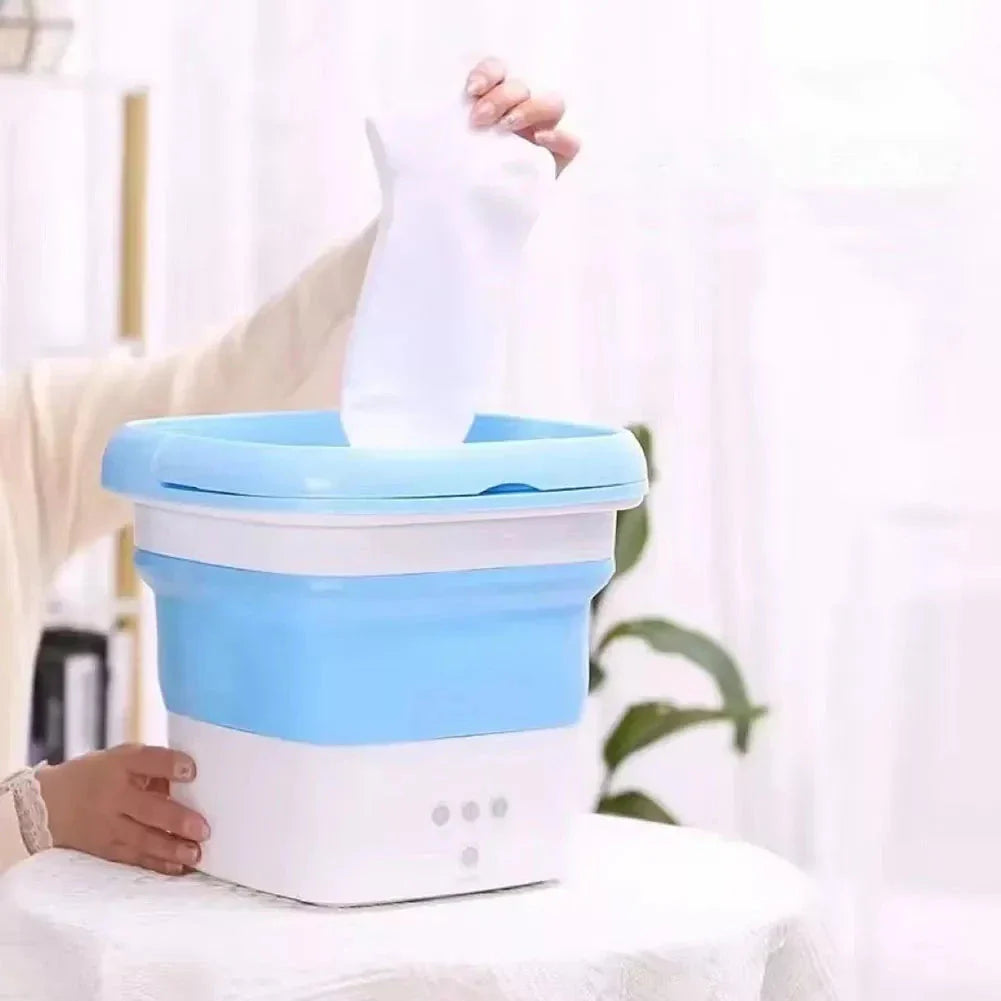 Compact and portable mini automatic washing machine with a sleek, space-saving design for small living spaces